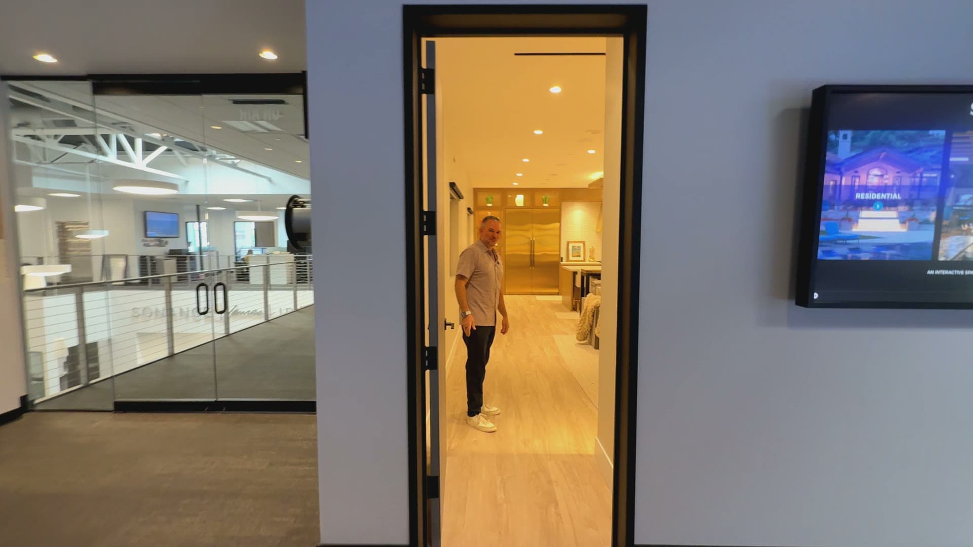 Adam welcoming you through the front door of the Sonance Studio in San Clemente