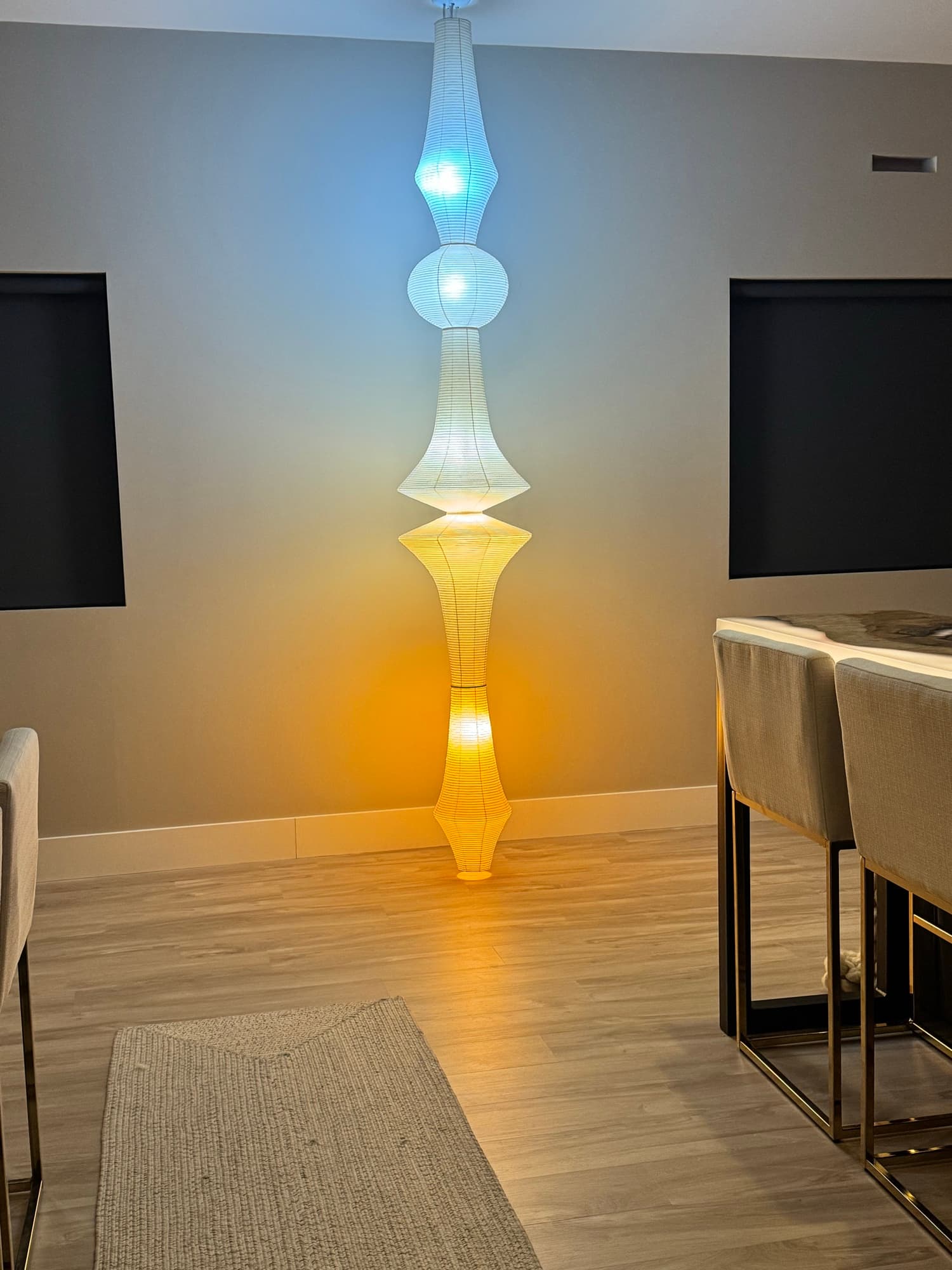 A Ketra-ready Noguchi paper fixture showing color temperatures from daylight to candlelight