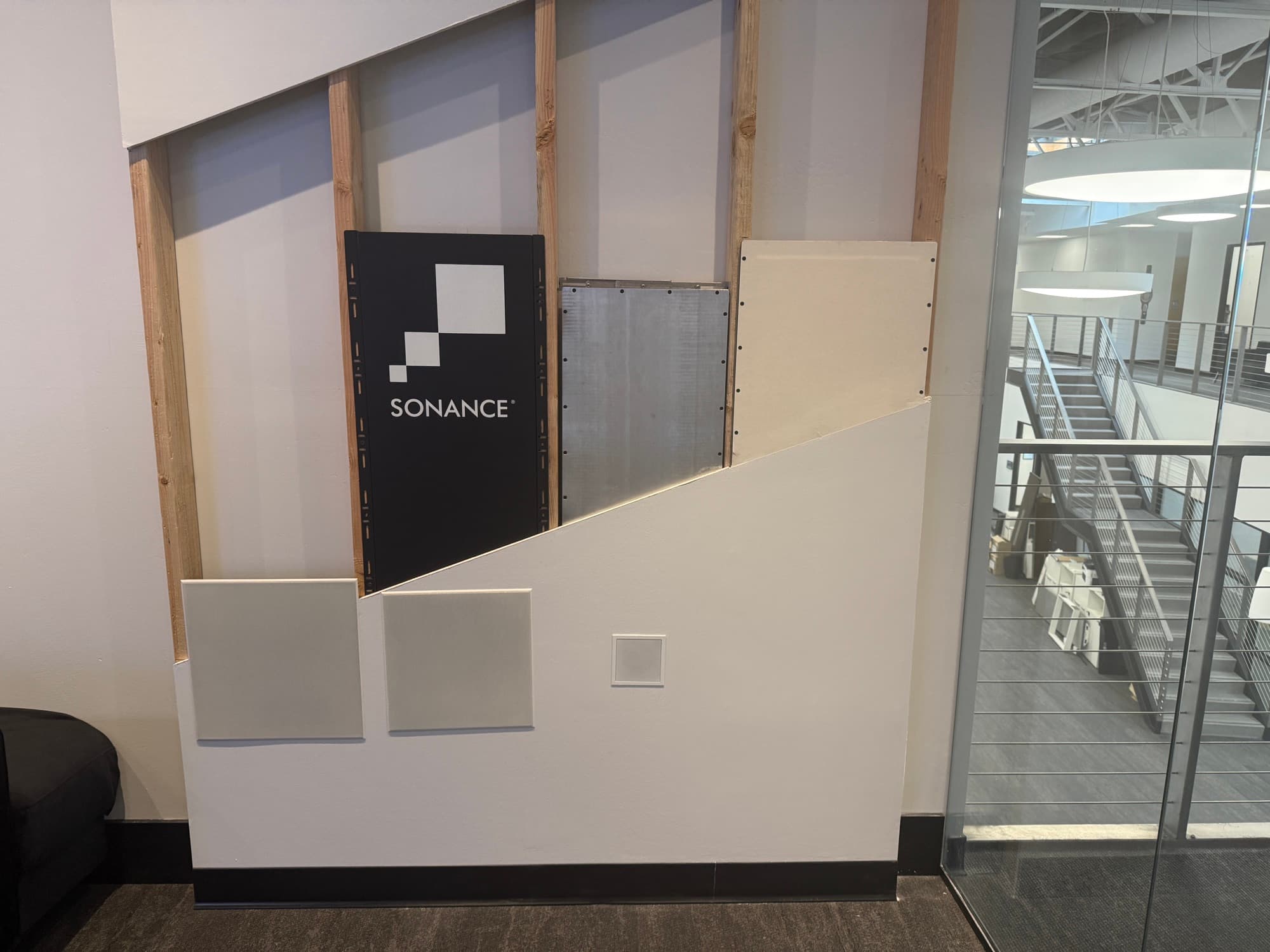 Cutaway install wall showing how Sonance Invisible Series speakers disappear behind drywall